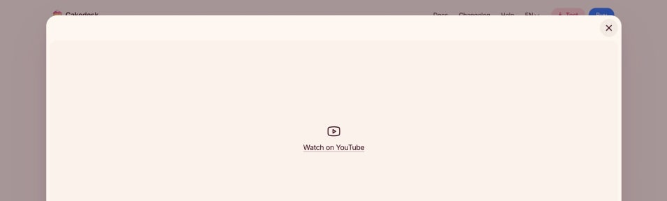 Modal dialog with cream background showing Watch on YouTube link with icon centered in empty space when embedded video fails to load